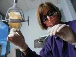 Study > regular teeth cleanings cut heart attack risk